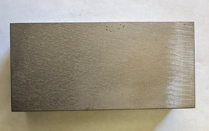 Metal cut with a waterjet, showing no heat-affected-zone or discoloration.